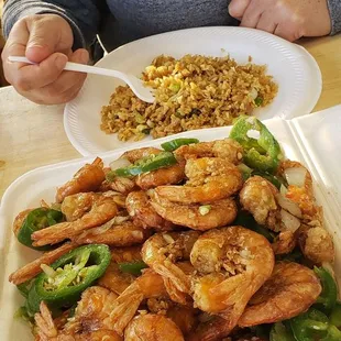 a plate of shrimp and rice