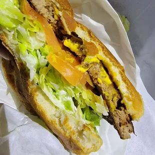Smash the bread over vegatablized, more mustard soured then sauce, soybean looking, dry non-cheese melting beef surprise product burger.