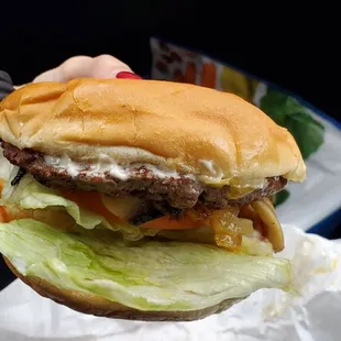 Cheese burger with grilled onions and mushrooms