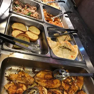 a buffet with a variety of food items