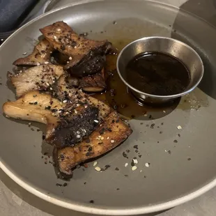 Grilled King Oyster Mushrooms, Black Garlic Jus, Gomasio