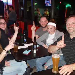 a group of people sitting at a table