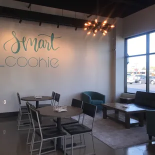 a dining area with tables and chairs
