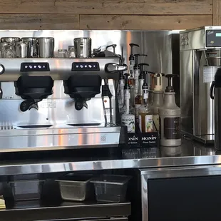 two espressors on a stainless steel counter