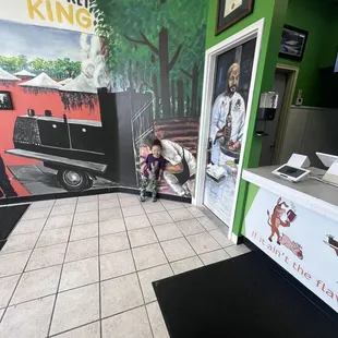 Inside the restaurant beautiful pictures and murals and my son smiling from ear to ear