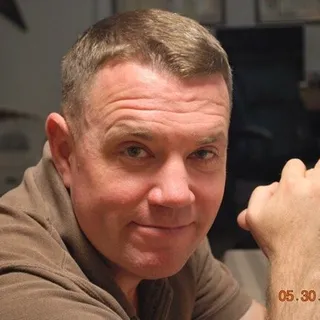 Travis J.