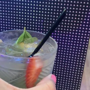 a person holding a drink