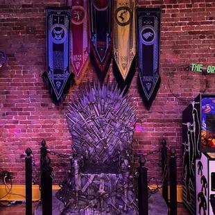 a game of throne with flags hanging on the wall