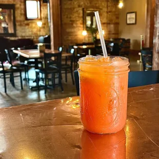  a glass of juice on a table