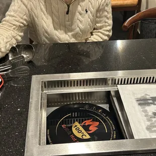 Hot pot or grill goes in middle of table