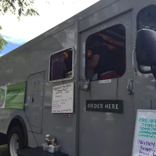  a food truck parked in a park