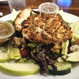 Nutty mixed up salad topped with blackened chicken--mixed greens with apples, cranberries, cucumbers, walnuts, &amp; sunflower seeds
