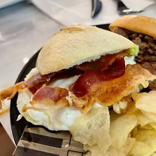 a sandwich and chips on a plate