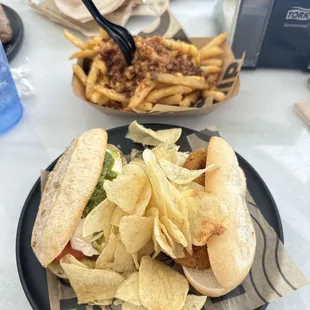a plate of chips and a sandwich