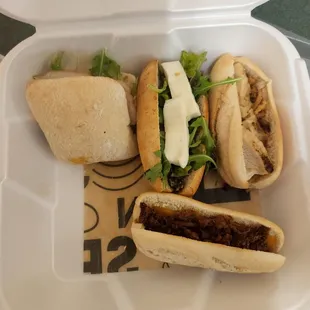 a close up of a sandwich in a styrofoam container