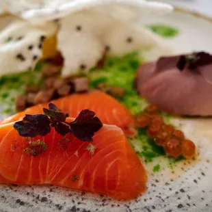 King salmon and hamachi sashimi w/ ikura, sudachi, orange, smoked takuan, pickled ginger vinaigrette