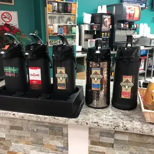 a counter with coffee machines