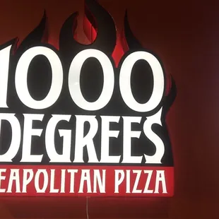 a neon sign for a pizza restaurant