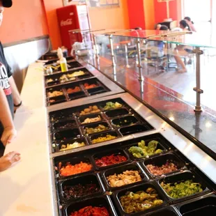 a man standing in front of a buffet