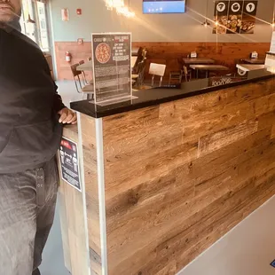 a man standing in front of a counter