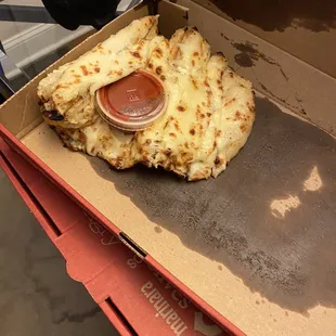 Raw garlic Cheesy Breadsticks with marinara.