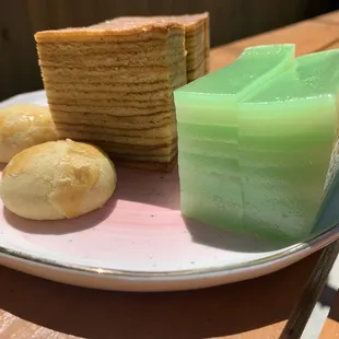 a slice of cake and a piece of bread on a plate