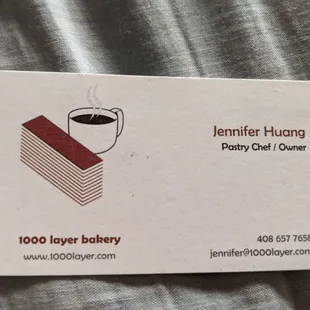 a business card with a cup of coffee