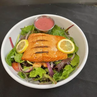 Grilled wild salmon over mixed greens