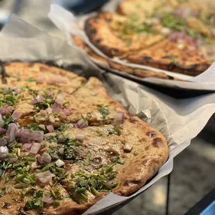 two pizzas on a table