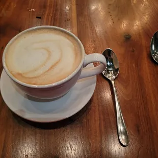 a cup of cappuccino on a saucer