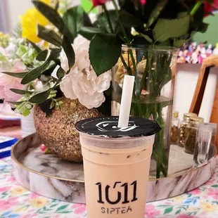 a cup of iced coffee on a table