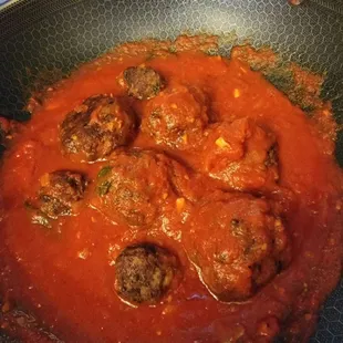 meatballs and tomato sauce in a skillet