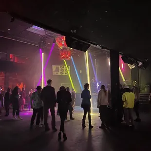 a group of people dancing at a nightclub