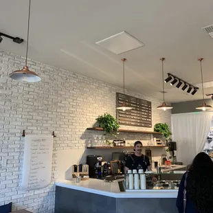 a woman standing at the counter