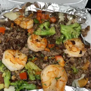 Steak and shrimp loaded potatoe