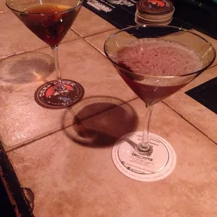 Manhattan on the left, Negroni on right.