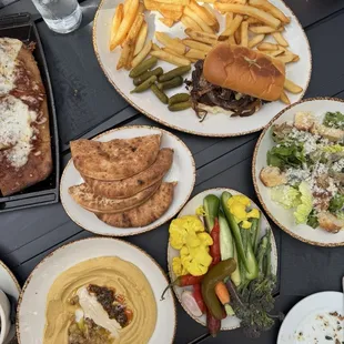 Burger, hummus, pizza, Cesar's salad.
