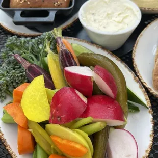 Focaccia + butter, hummus + pita &amp; crudite