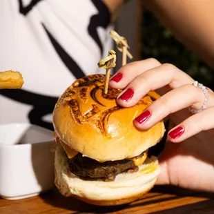 a woman eating a hamburger