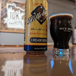 a can of ice cream soda next to a glass of beer