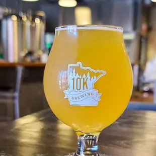 a glass of beer on a table