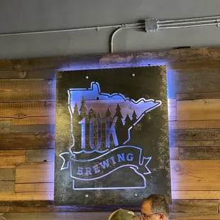 two men and a woman sitting at a table