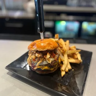 a burger and fries on a plate
