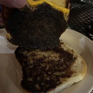 My sons simple cheese burger ... not fit to eat....smh