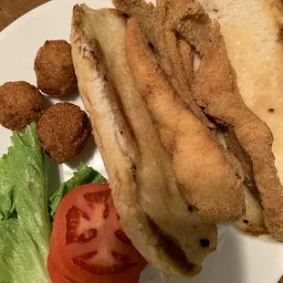 Catfish po&apos; boy and hush puppies.  Where&apos;s the pickles?  Where&apos;s the rémoulade??  Ask the chicken Philly. Spoiler alert - all were missing.