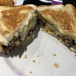 1/2 LB Cheeseburger between two grilled cheese sandwiches