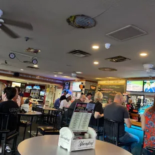 people sitting at tables and eating