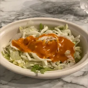 Side salad, cheese and lettuce.