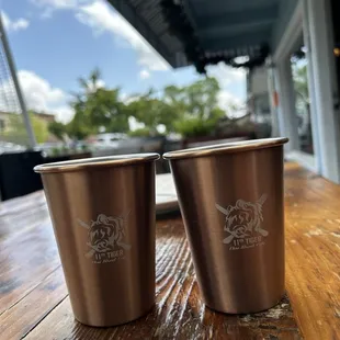two cups on a wooden table