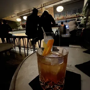 a drink in a glass on a table